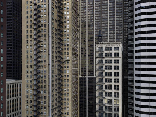 Michael Wolf Artwork | Dramatic muted large-format architectural photographs of Hong Kong Chicago and Paris, portraits from the Tokyo subway.